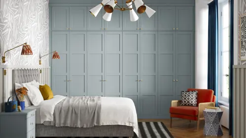 Duck egg blue hinged wardrobe with gold handles.